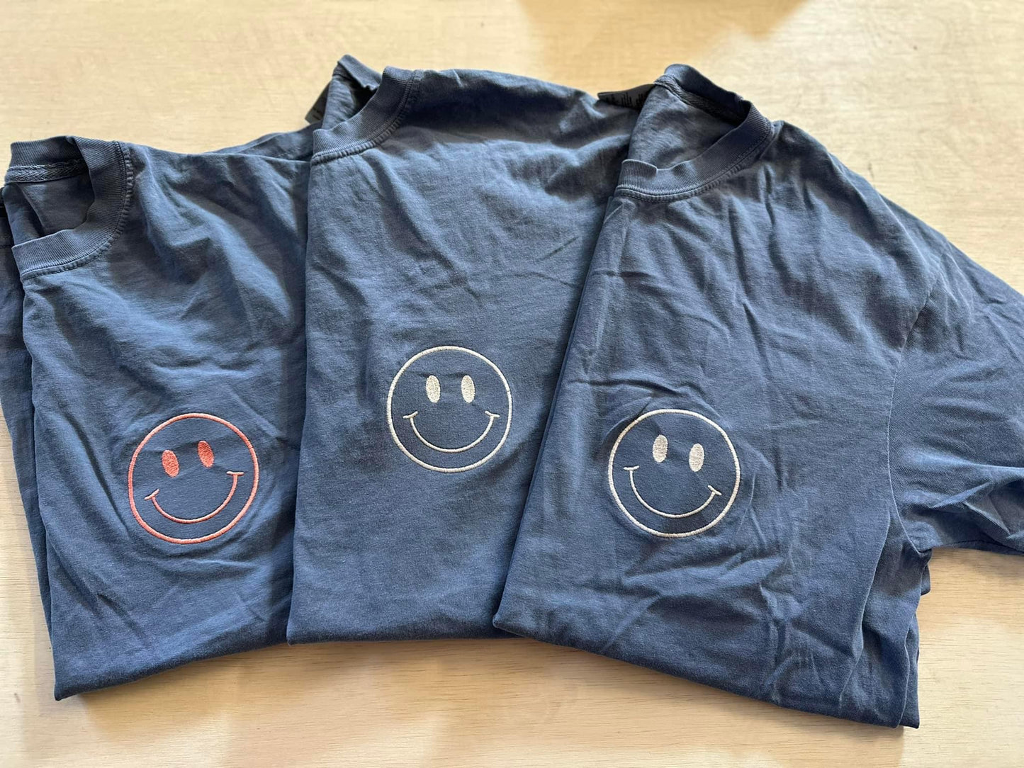 Oops Mystery Smile Tees